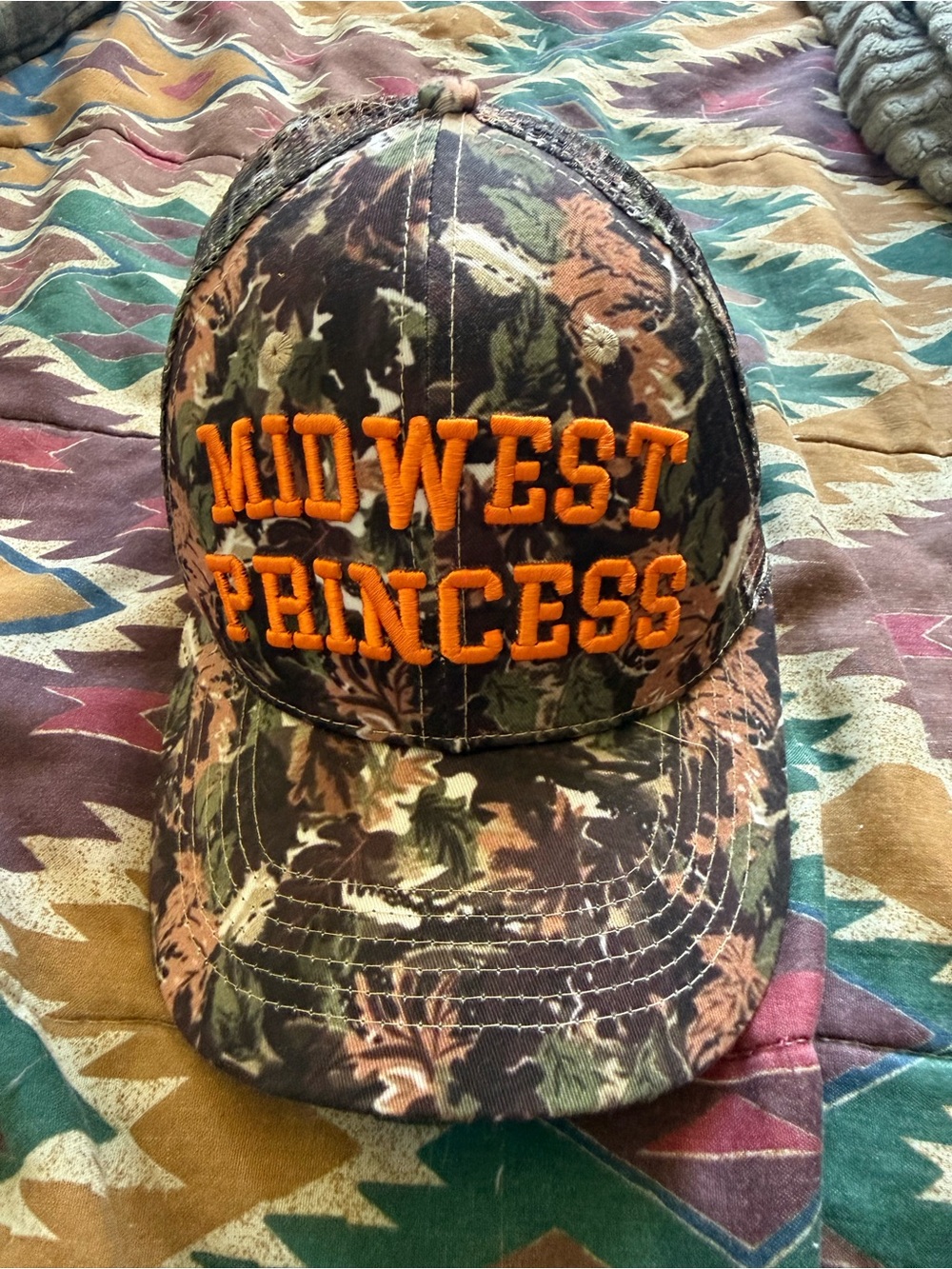Camouflage 'Midwest Princess' Trucker Hat with Orange Embroidery Chappell Roan